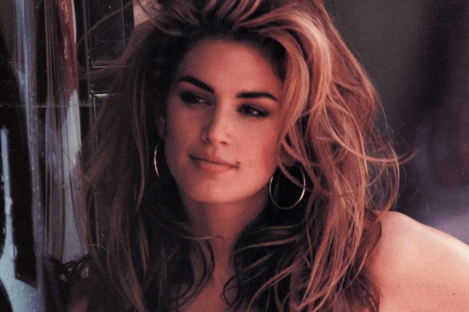 Close-up portrait of voluminous, tousled hair with warm lighting