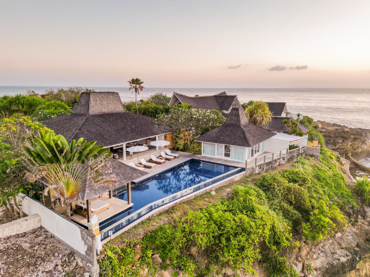 Aerial view of Villa Tranquilla clifftop infinity pool at sunset, Nusa Lembongan