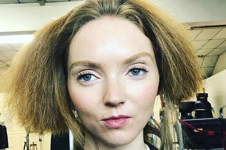 Woman applying eyebrow makeup with tweezers and cosmetic products on vanity