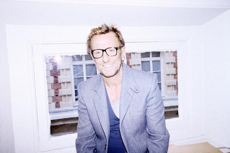 David Mallet in his Paris salon surrounded by eclectic art, sculptures and a stuffed ostrich named Babeth