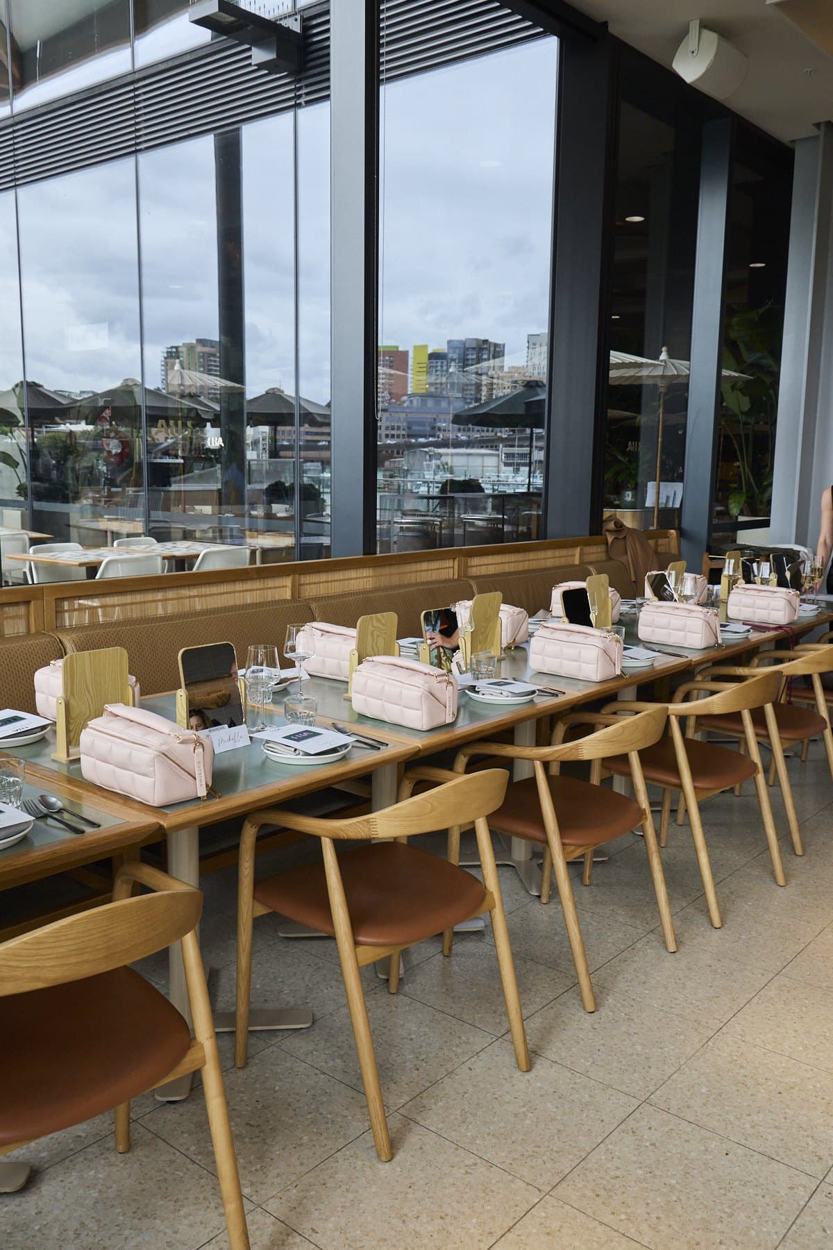 The long table at Lua set for lunch, with menus and a mirror at each place, before the guests arrived