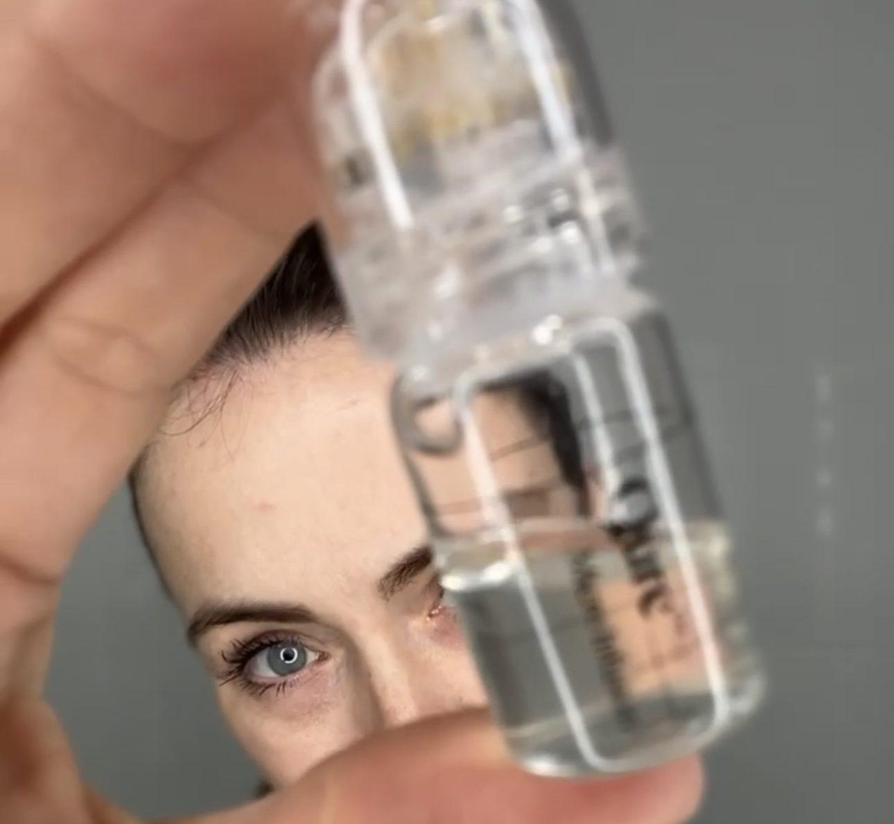 Qure Micro-Infusion Facial System kit with gold needle heads and serum ampoules.