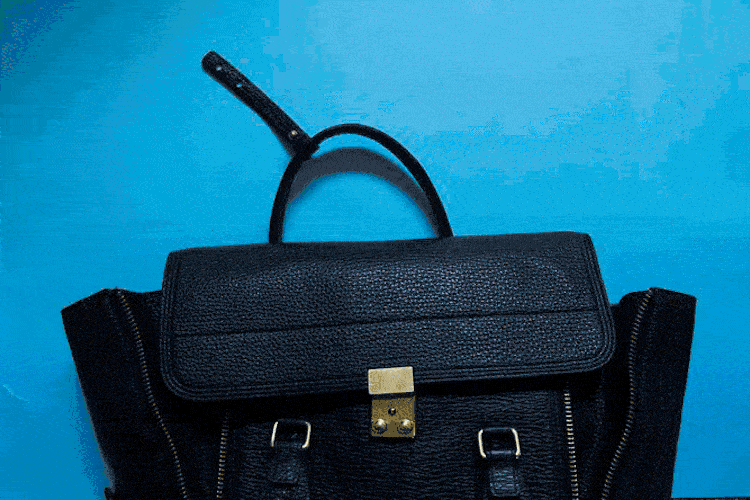  Bag by Phillip Lim; Laptop by Apple; Shoes by Valentino; Sunglasses by Karen Walker; Watch by Larsson & Jennings; Kosmea Cleansing Wipes; Grown moisturiser and lip balm; Morrocanoil; The Beauty Chef Beauty Balm. 