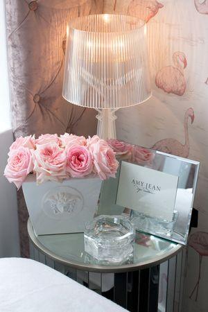 Fresh blooms and bespoke wallpaper decorate the space