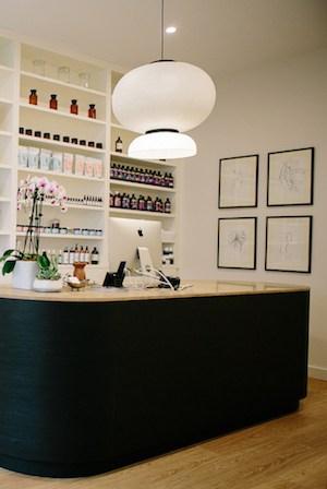 Facial treatment room at Vaia Beauty with fresh flowers and crystals
