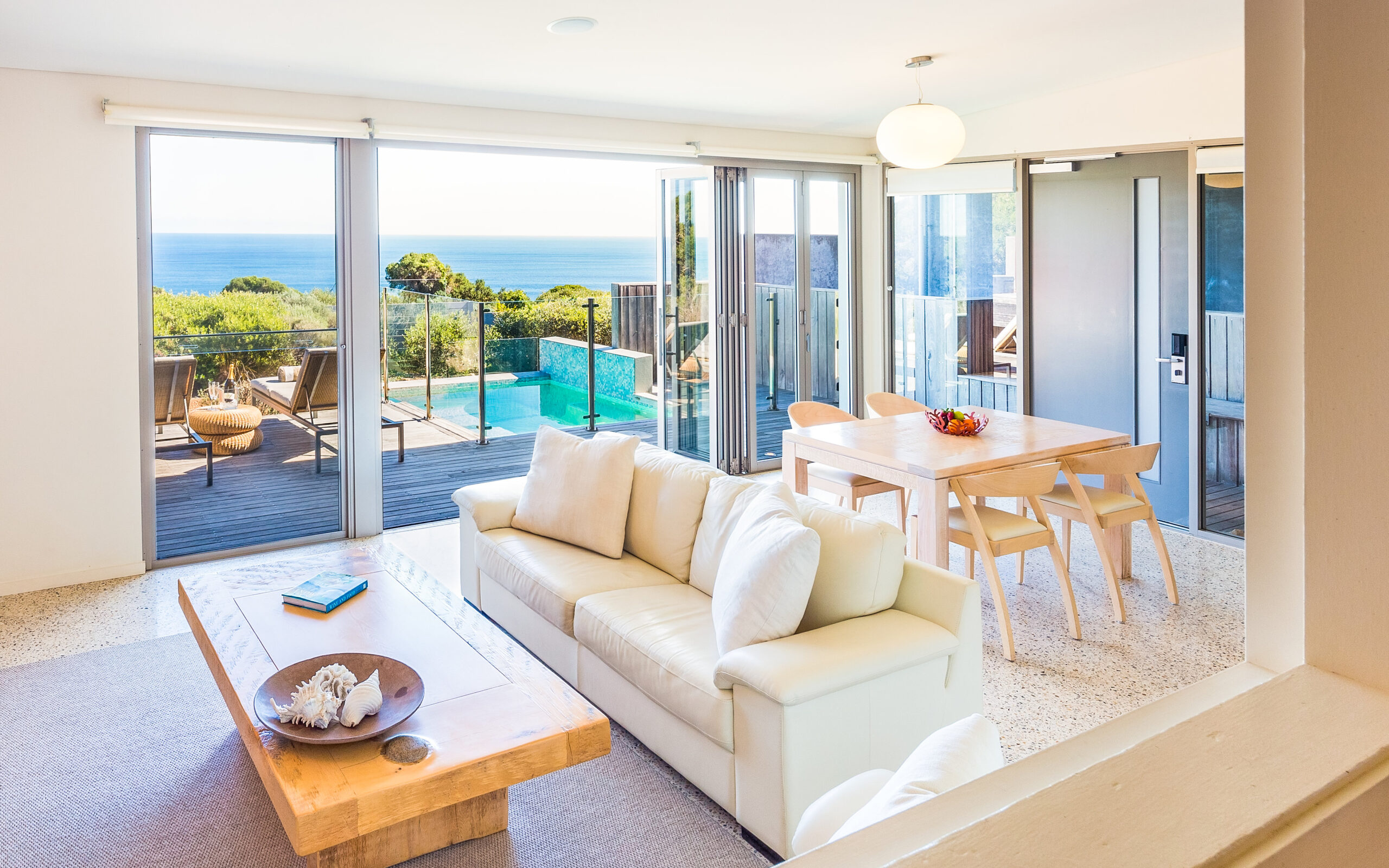 Villa living area with plunge pool and ocean views at Injidup Spa Retreat