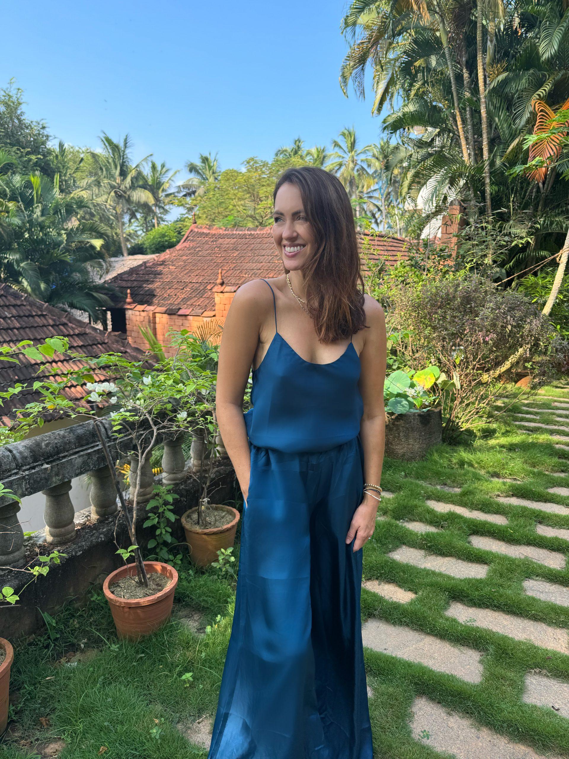 Sigourney standing in the courtyard of Somatheeram Ayurveda Resort Kerala