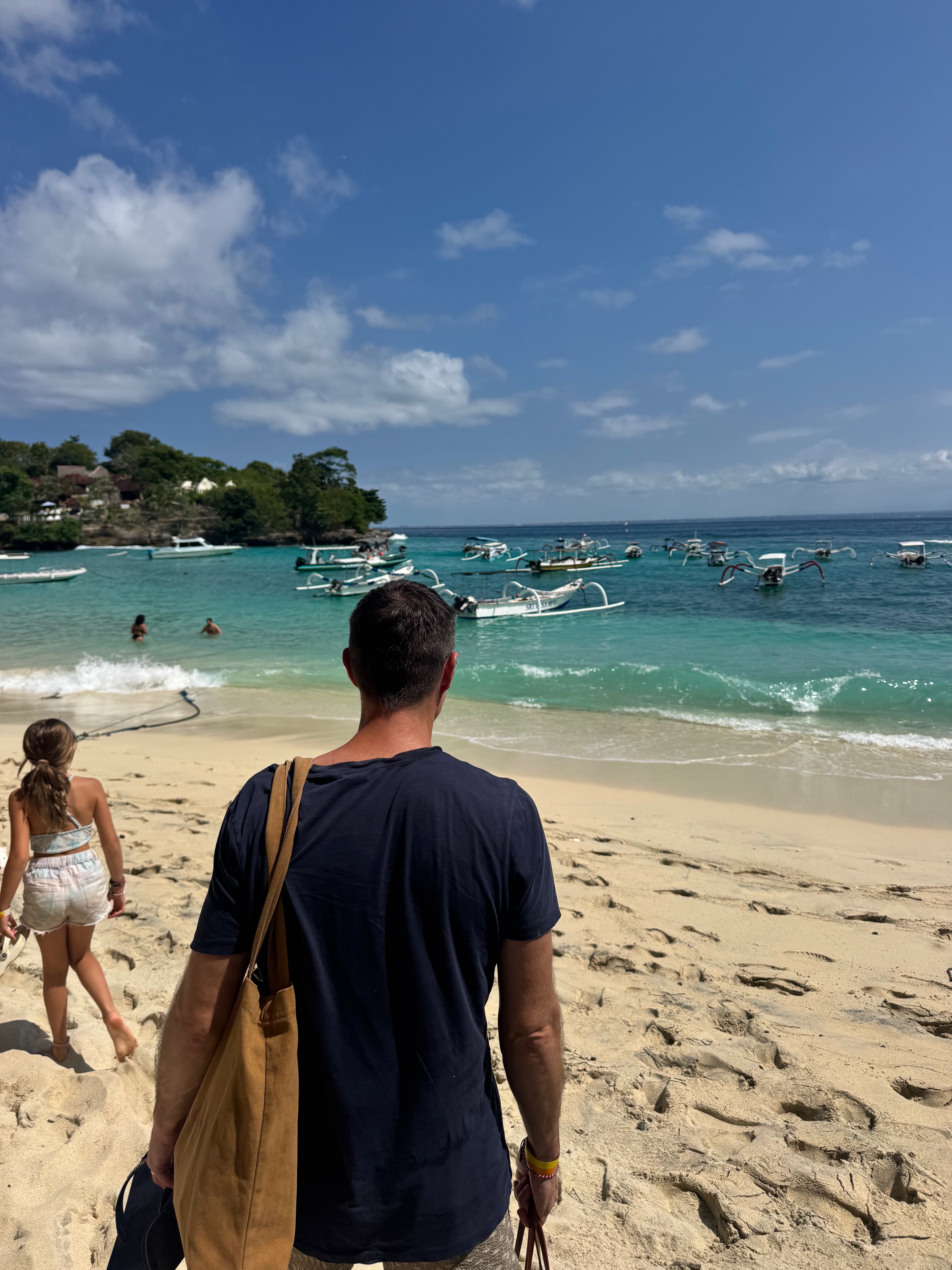Approaching Nusa Lembongan — traditional jukung boats moored in the turquoise shallows