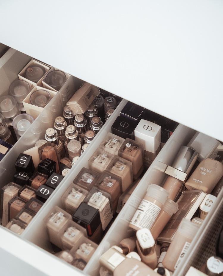 Stacked copies of Rae Morris Timeless Makeup and Makeup The Ultimate Guide books on a wooden shelf