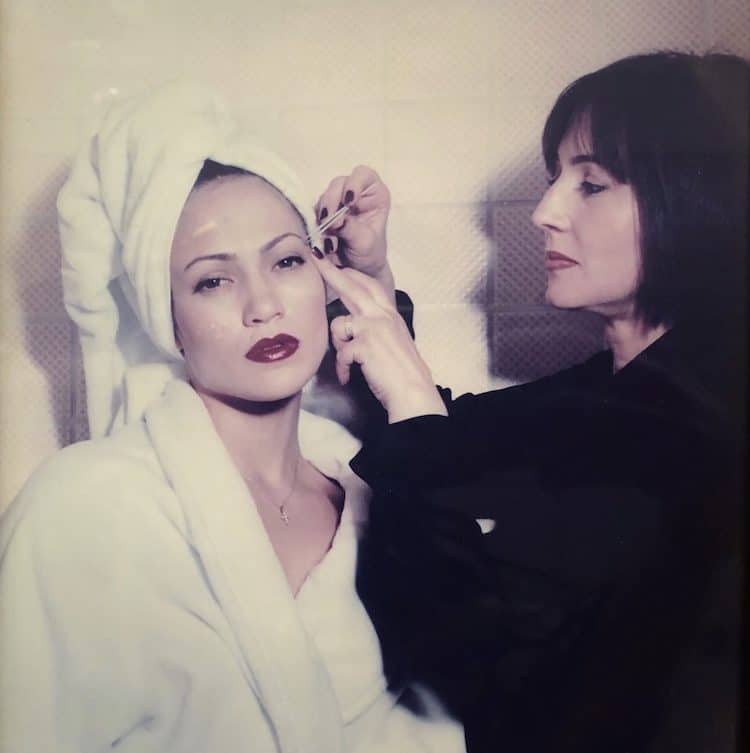 Anastasia tending to the brows of J.Lo, an early client