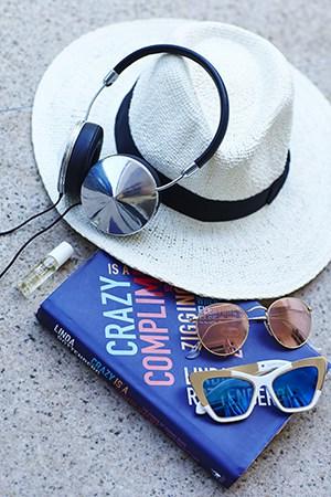 Natasha Oakley beach essentials with Kai perfume oil and sunglasses