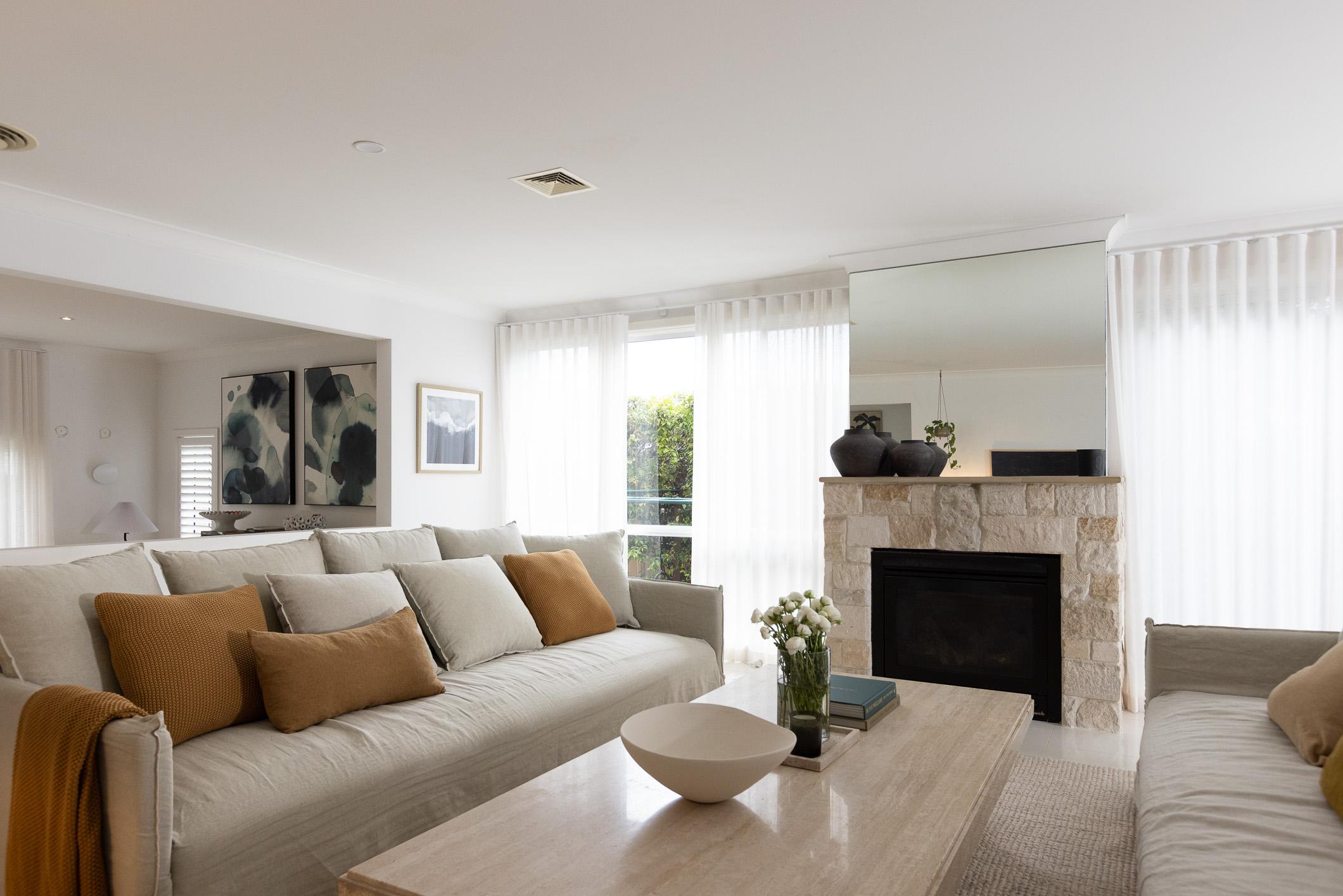 Sigourney in her living room styled with Oakbank Linen sheer curtains from 5 Minute Blinds